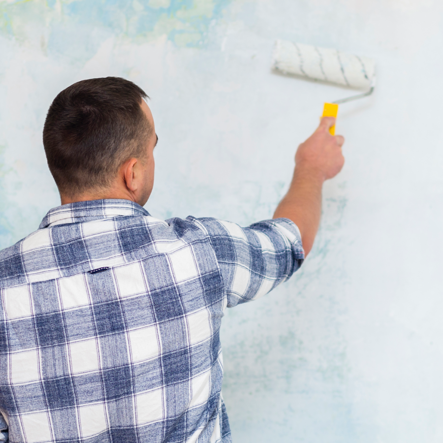 back-view-man-painting-wall